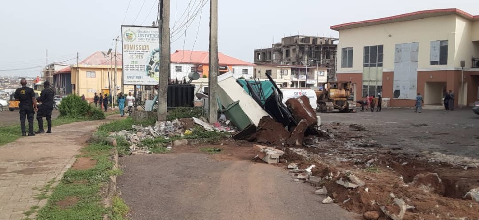 Reactions as Kwara pulls down multi-million naira mall of APC chieftain