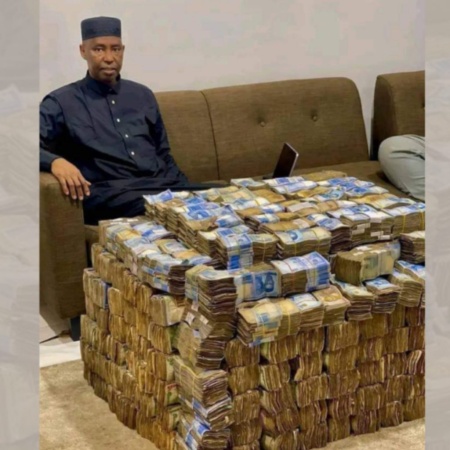 Lawmaker under fire for displaying wads of cash amid economic hardship
