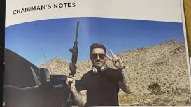 Football chairman fined for gun photo in programme