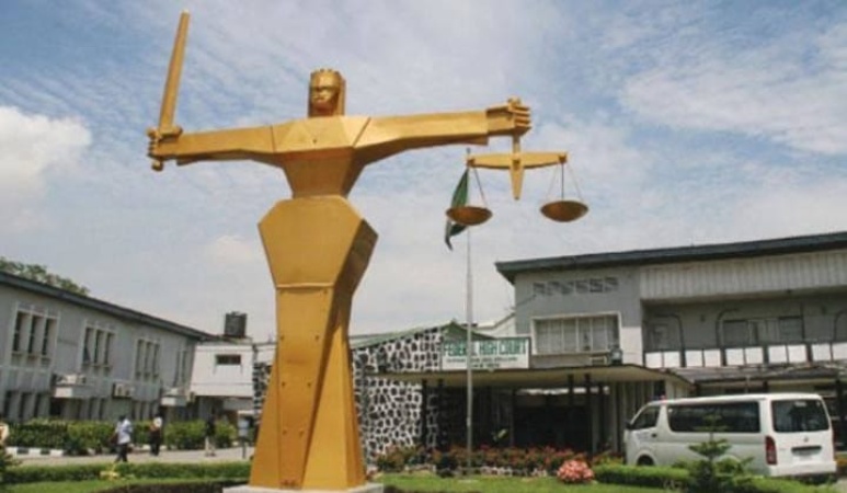 Court restrains two estate firms from Abuja plot