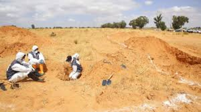 Bodies of migrants found in Libya mass grave, authorities say