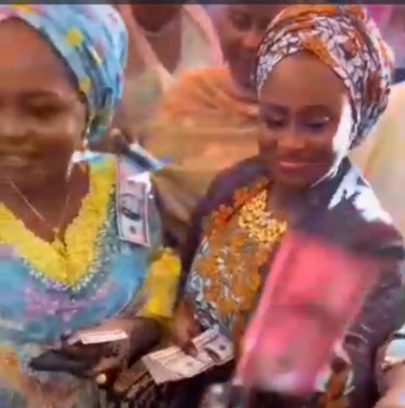 CONFIRMED: Governor?s wife sprays US dollars at wedding ceremony