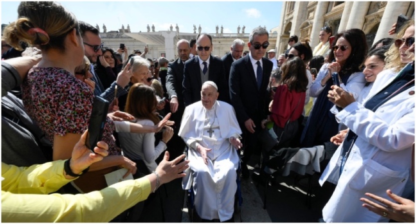 Recovering Pope Francis surprises crowd at Vatican