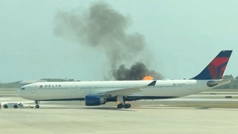 Panic as plane with almost 300 on board catches fire on tarmac