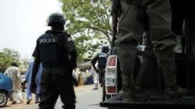 Police escort arrested for killing soldier over truckload of minerals