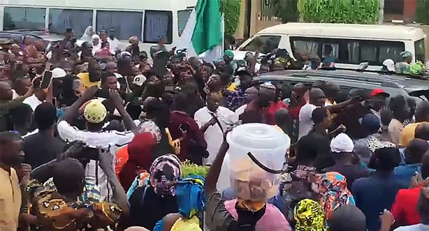 Supporters march with Natasha to celebrate unsealing of her office