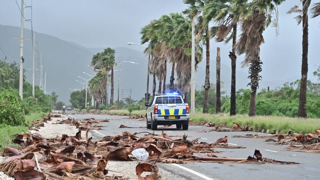 Jamaicans wake to devastation as hurricane causes floods, power cuts and splits city in two