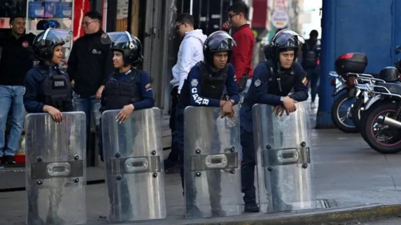 Venezuelan security forces detain journalists as armed police patrol streets