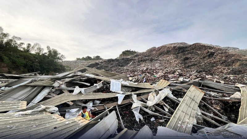 Rescuers race to find dozens missing after deadly landfill collapse in Philippines