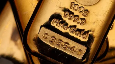Gold tops $5,000 for first time ever, adding to historic rally