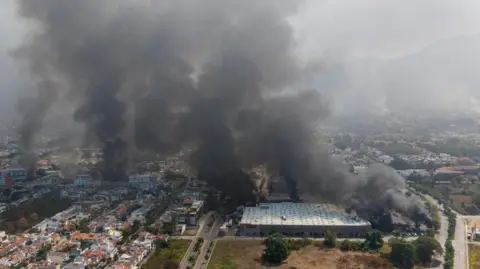 Mexico hunts 23 inmates sprung from jail during wave of violence