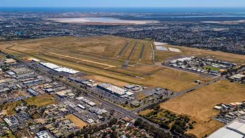 Two dead after small plane crashes into Australia airport hangar
