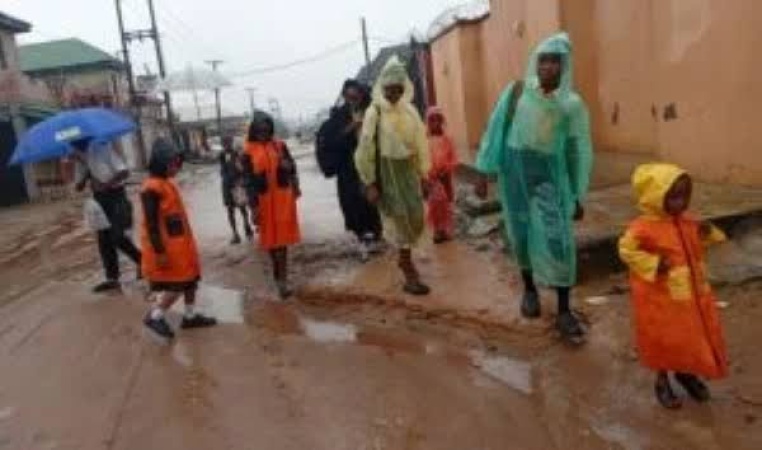 Lagos residents abandon umbrellas for nylon raincoats as rainfalls intensify