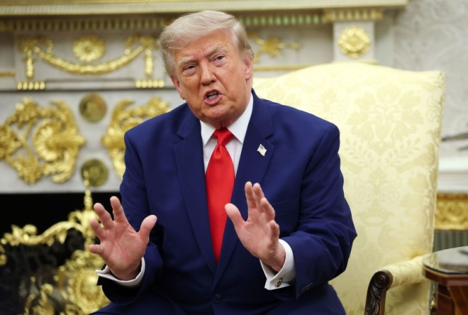Trump downplays Chinese election interference five days after describing breach of historic proportions