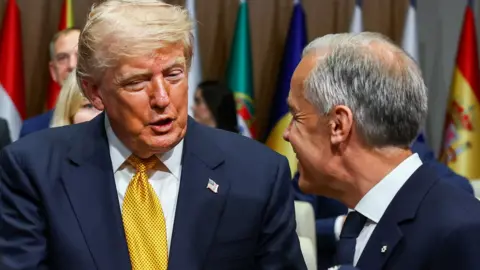 Trump slaps 50% tariffs on Canada and Carney vows to 'intensify' trade talks