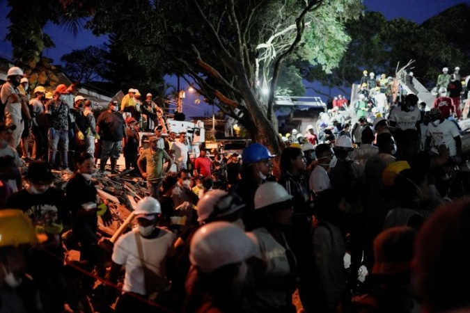 After a whisper saved baby and father from rubble, the search is on for mother in collapsed building in Colombia