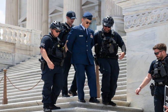 Trump criticism leads to rare criminal charges for Air Force officer who called for impeachment
