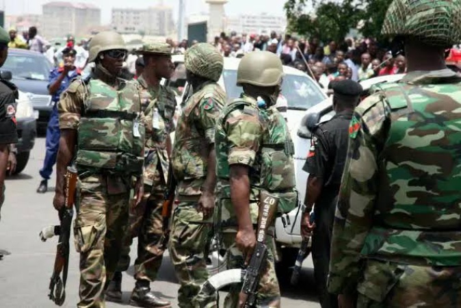 Troops arrest 10 suspected illegal miners, seize 21,000 bags of black sand in Bayelsa