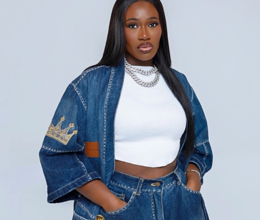 Real Warri Pikin apologises after Timaya lifts her on stage