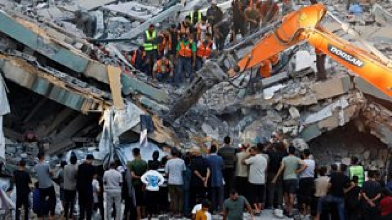 Eight children among 21 killed after war-damaged Gaza building collapses, rescuers say