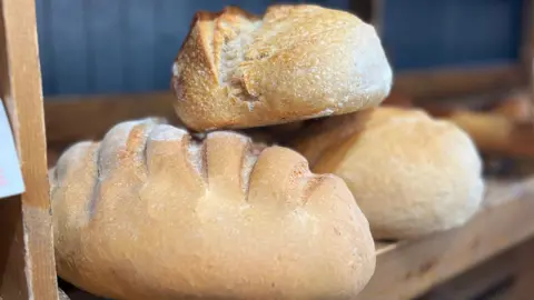 Why is folic acid being added to bread flour?