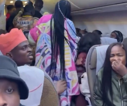 Mid-air drama as man attempts to open plane’s emergency exit  
