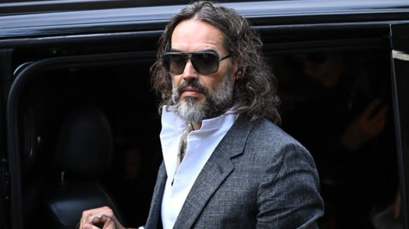 Russell Brand appears in court for start of rape trial