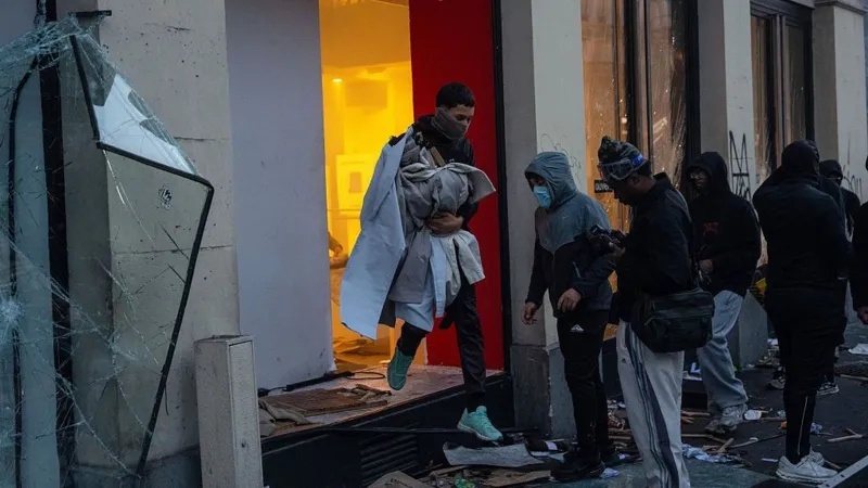 Violent clashes, looting and buildings ablaze in France as over 1,000 arrested after protests