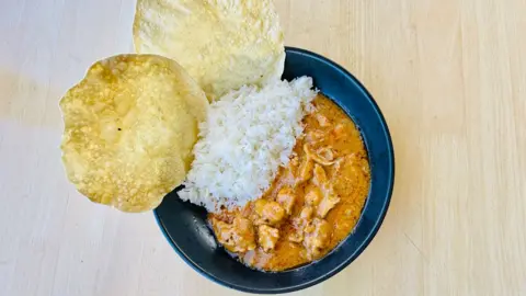 Australian woman charged with lacing colleague's curry with snail poison